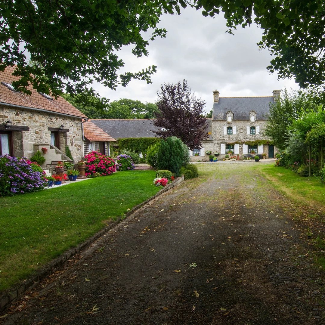 Looking down the driveway of Manoir de Guervihan; a residential home for sale in Brittany, France